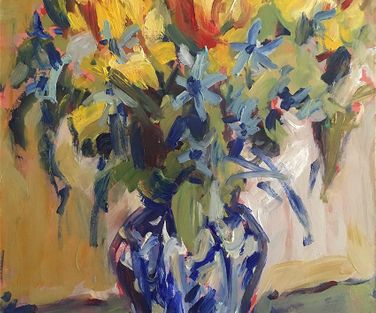 Tulips and blue bells in Delft vase.