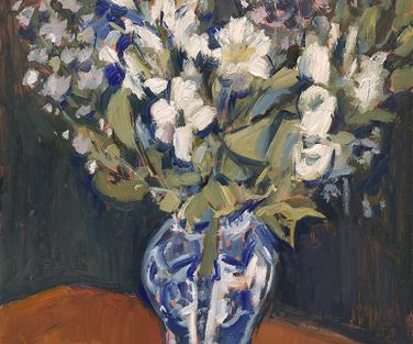 Still life with fresh flowers in Delft blue vase 